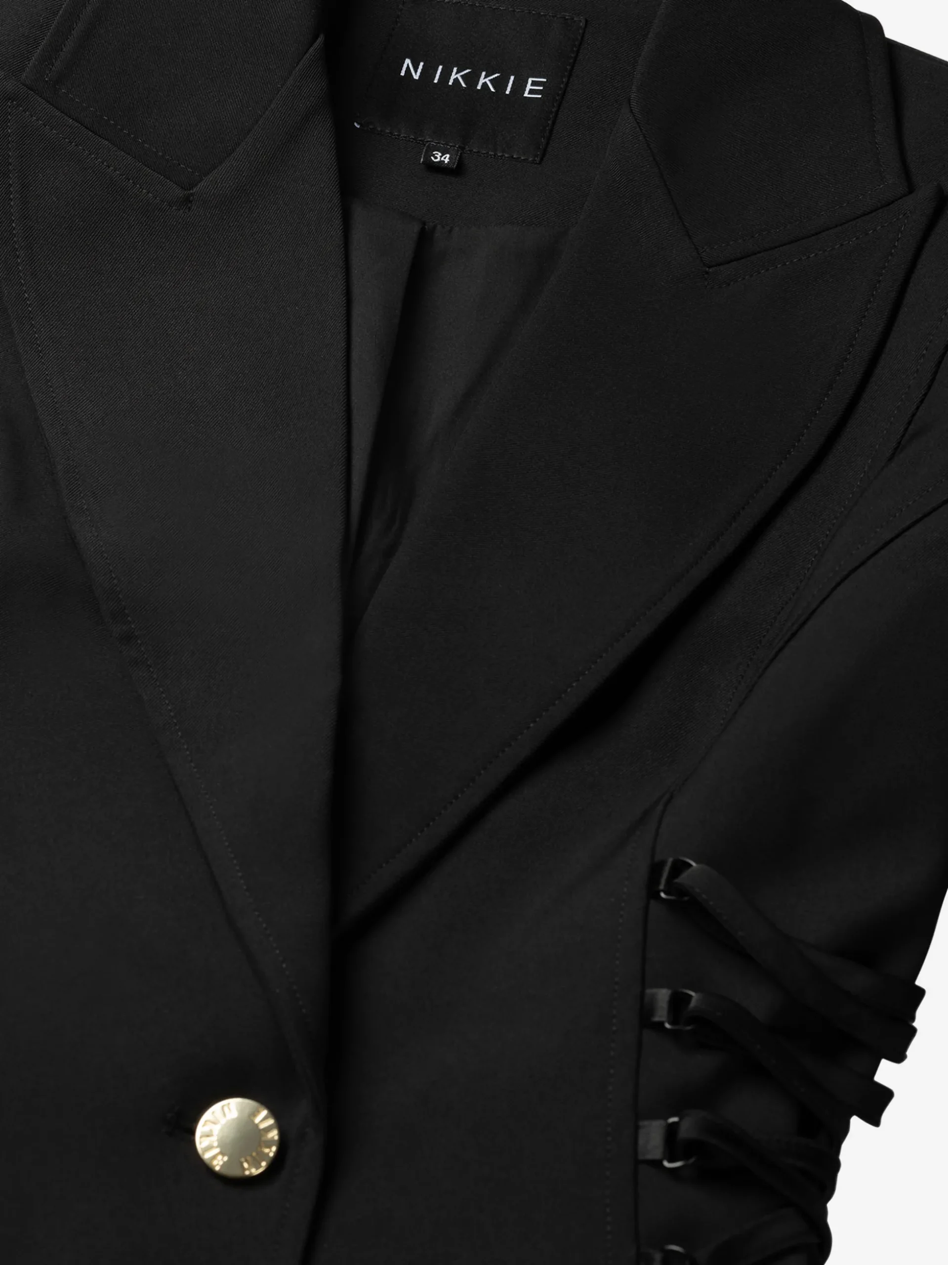 Aansluitende blazer met veter details