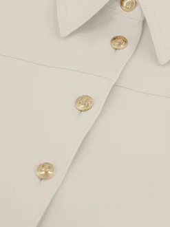 Aansluitende jumpsuit met rij FH knopen en wijde pijpen