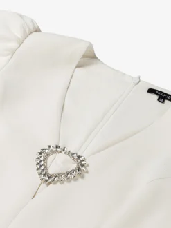 Aansluitende top met pofmouwen en strass detail