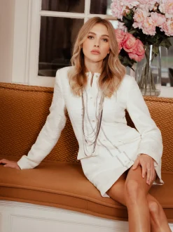 Aansluitende tweed jurk met N-knopen