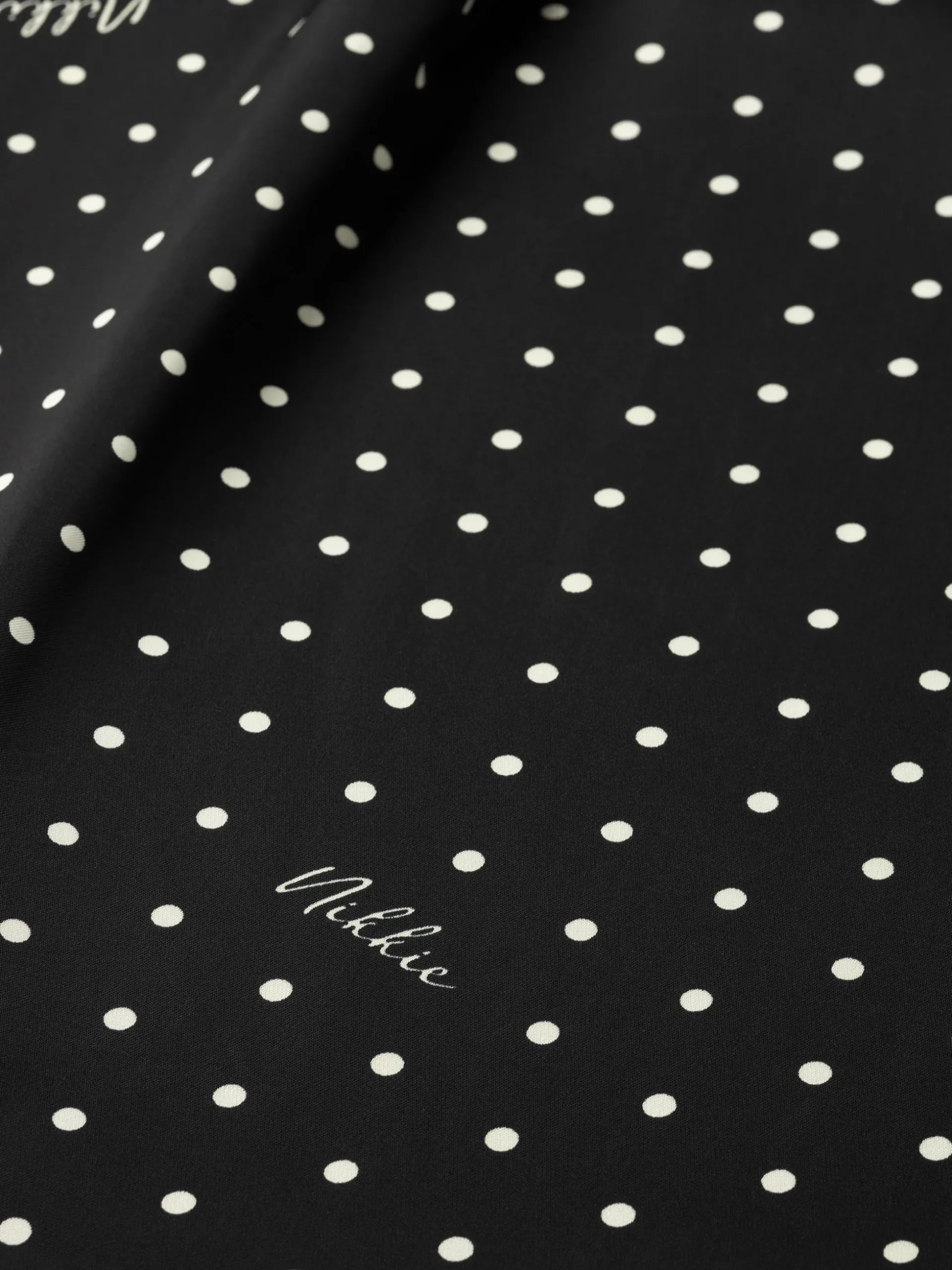 Blouse met stippen en strikkoord