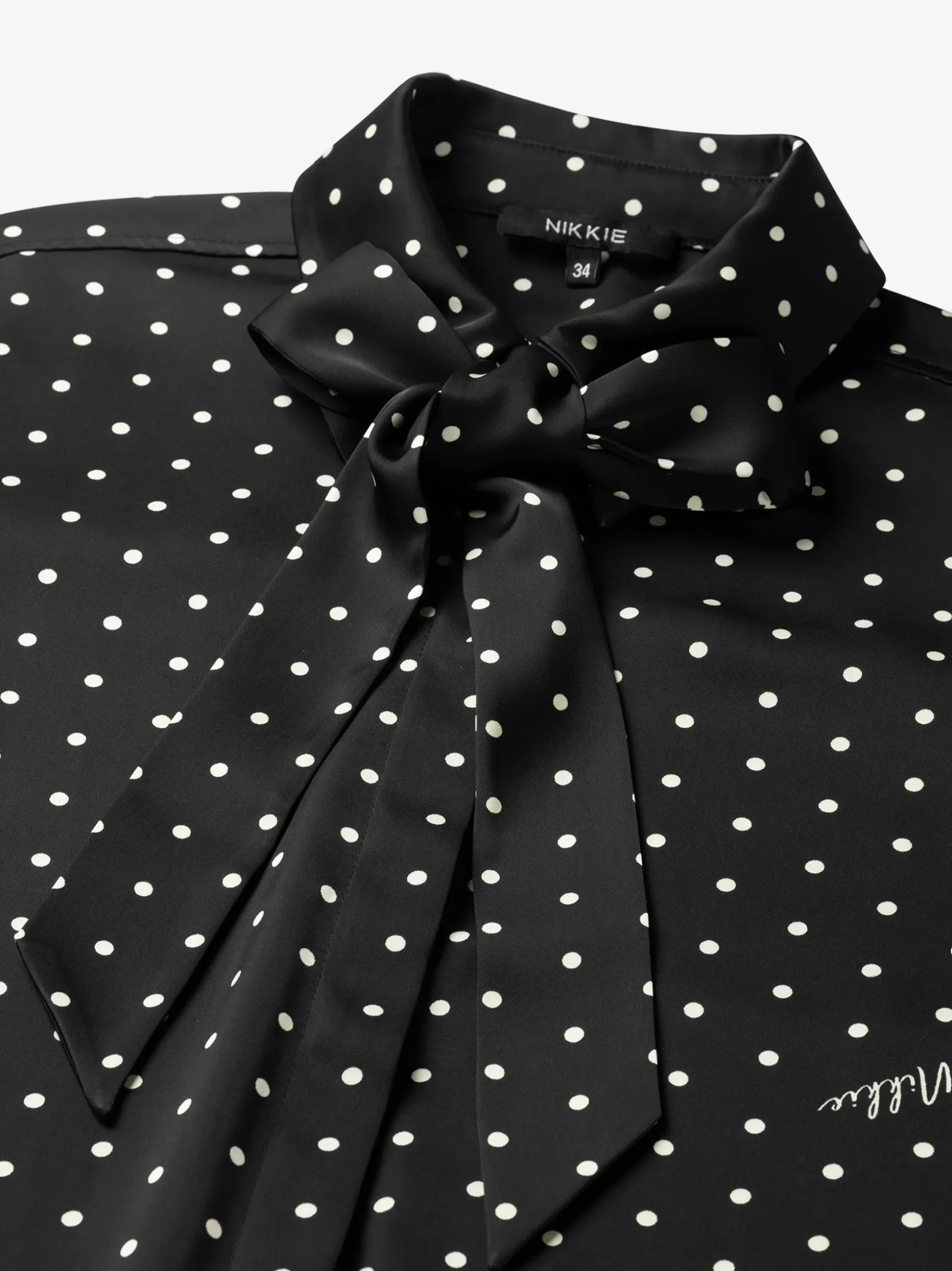 Blouse met stippen en strikkoord