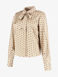 Blouse met stippen en strikkoord
