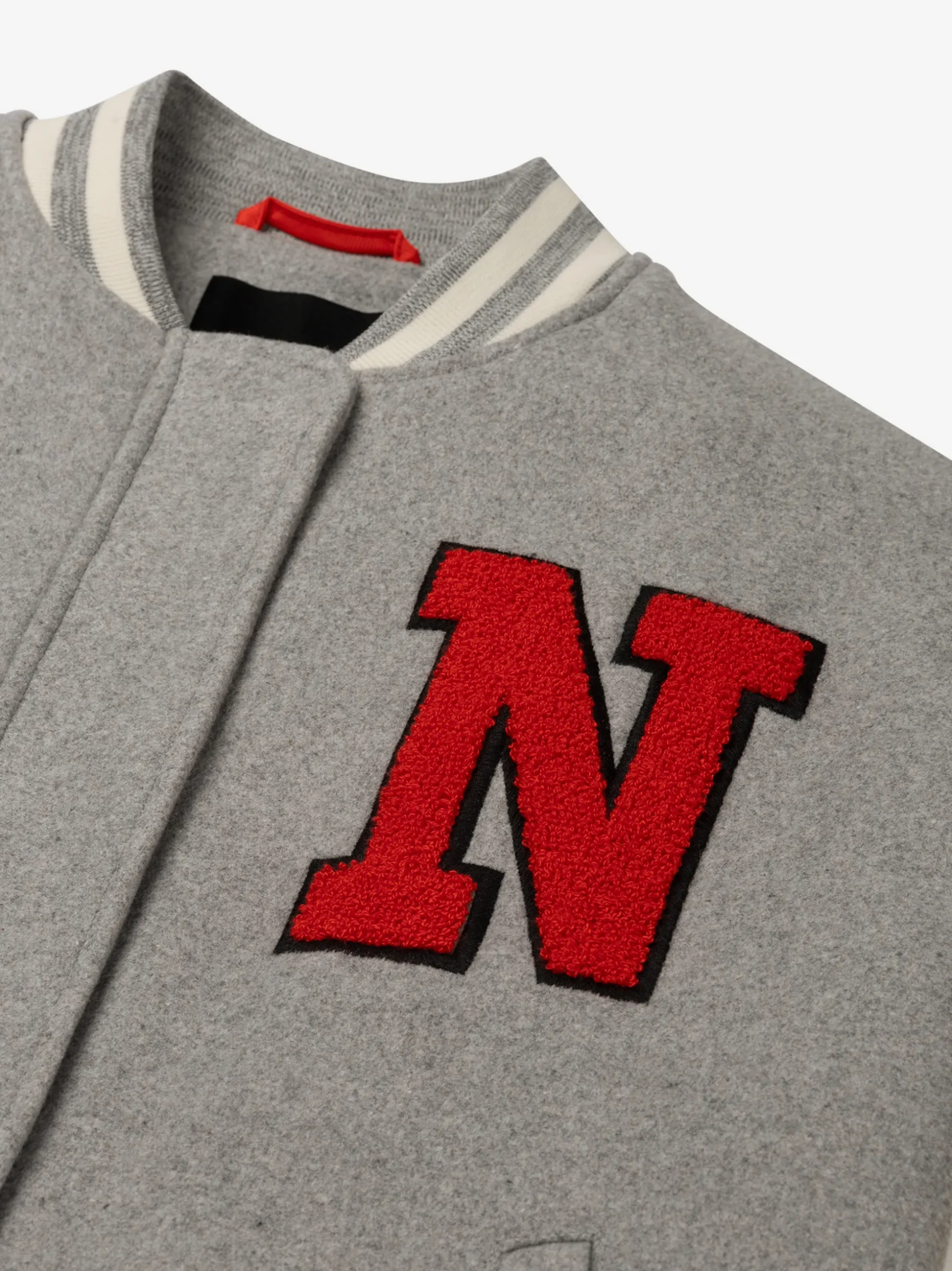 Bomberjack met N-logo en geborduurde university print