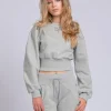 Cropped sweater met brede elastische tailleband
