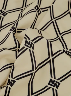 Flared broek met N&N logo patroon