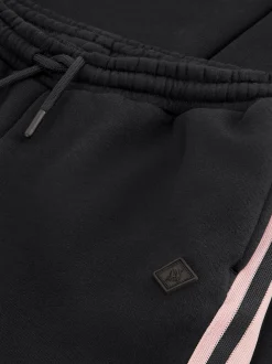 Flared joggingbroek met strepen op zijkanten