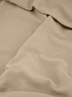 Geribbelde flared legging met omgeslagen taillerand