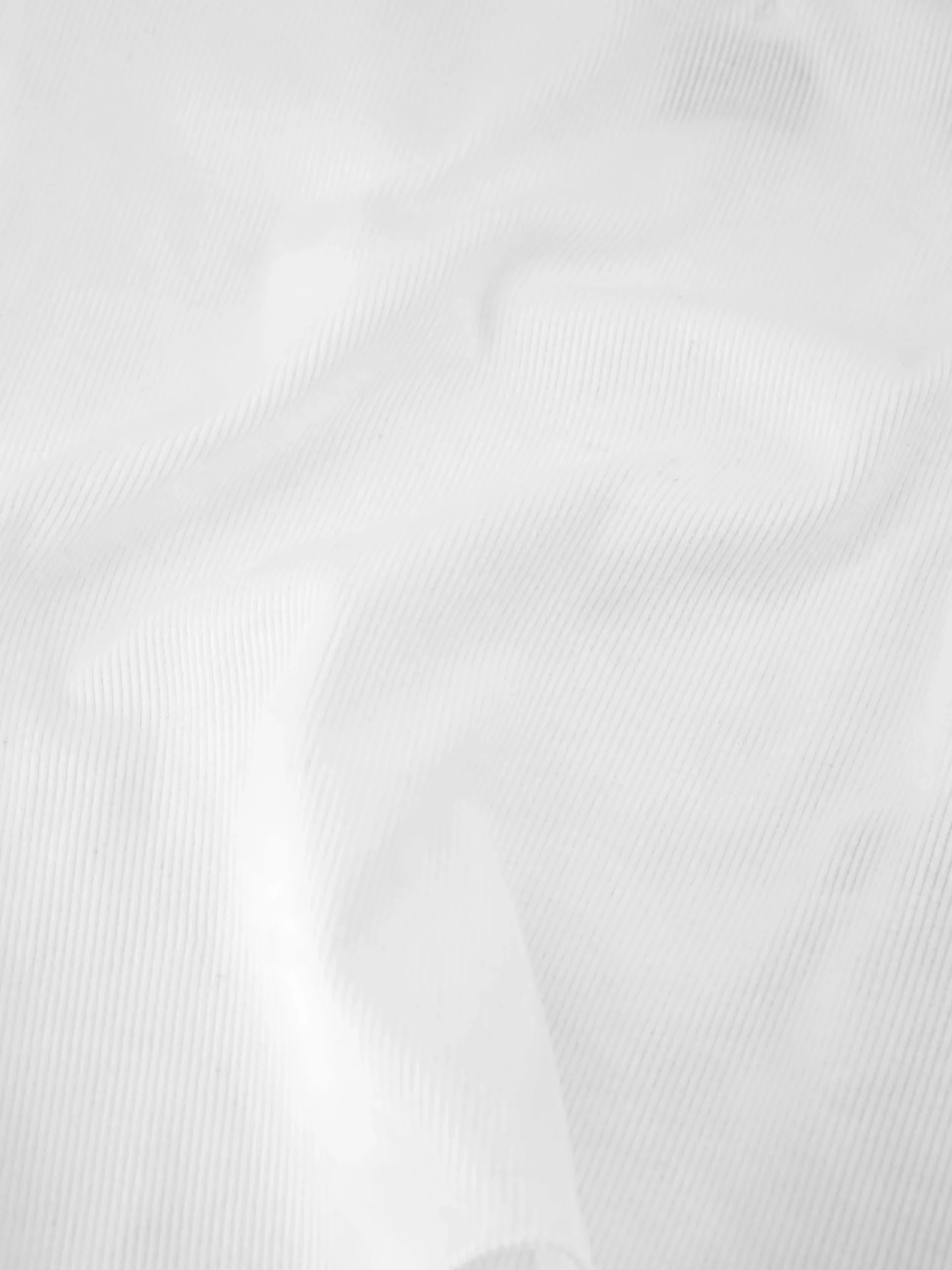 Geribde top met gedrapeerd detail