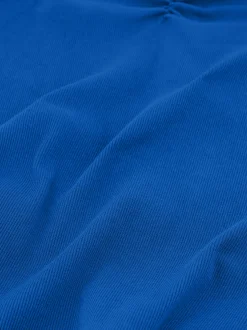 Geribde top met gedrapeerd detail