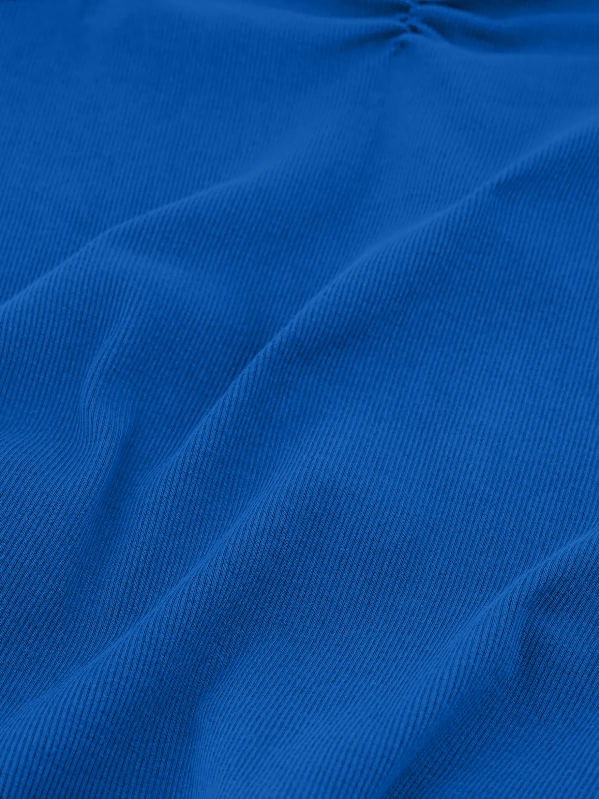 Geribde top met gedrapeerd detail