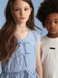 Gestreepte top met ruches en strikdetails