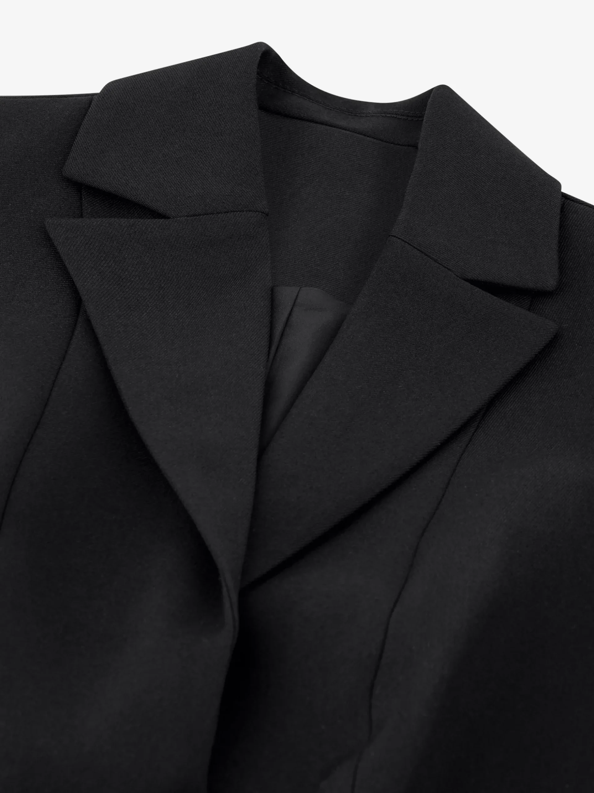 Kort gilet met overslag en N-knopen