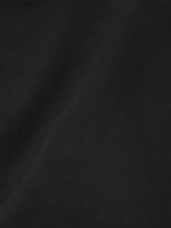 Korte aansluitende skort met een overslag en N-knopen