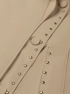 Lange trenchcoat met tweelaags effect en studs