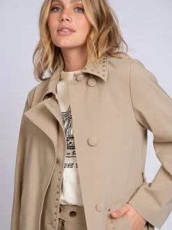 Lange trenchcoat met tweelaags effect en studs