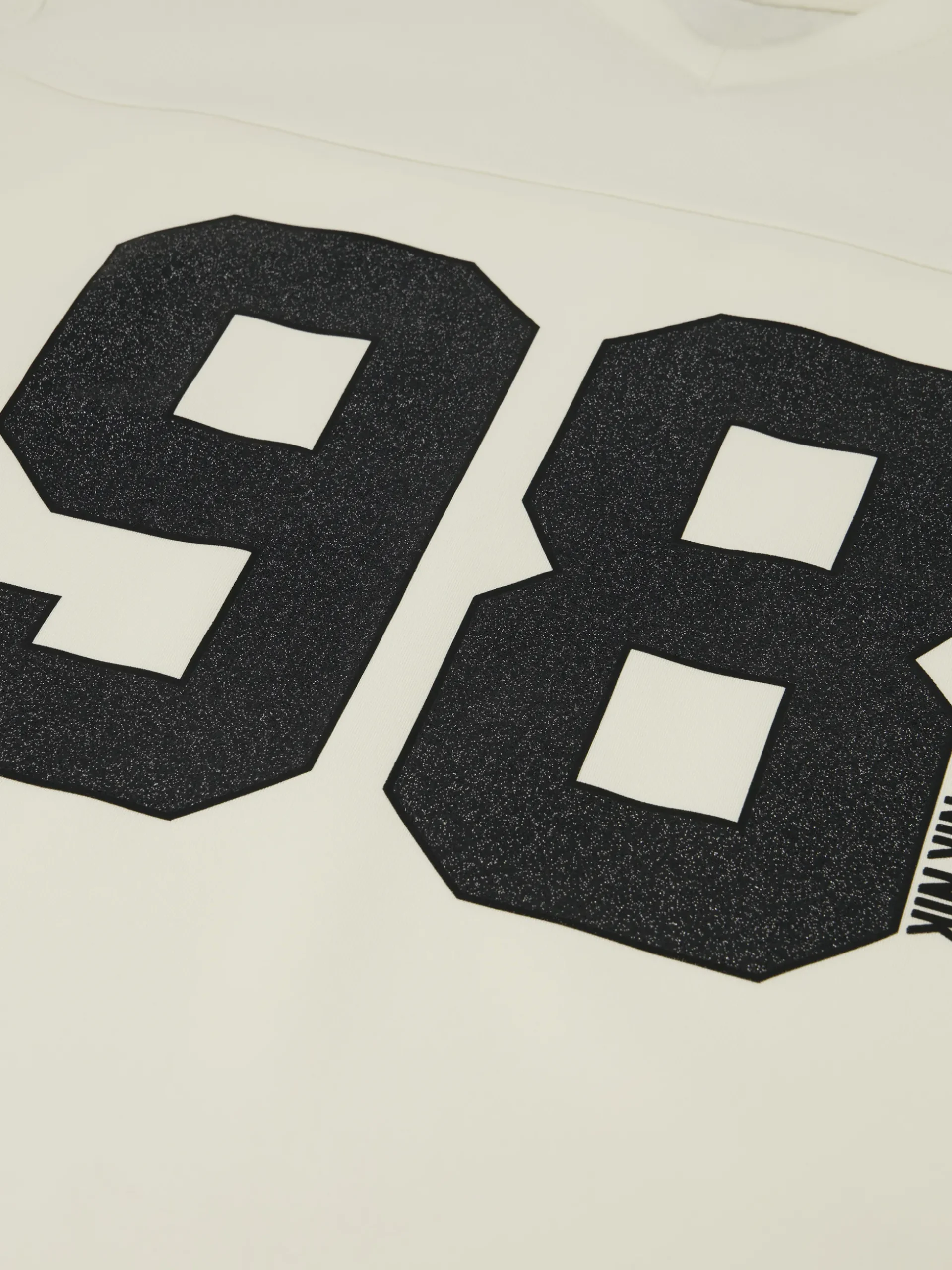 Losvallend varsity T-shirt met grafische print
