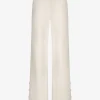Losvallende broek met logo patroon en sierknopen