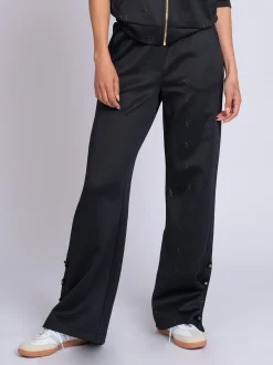 Losvallende broek met logo patroon en sierknopen