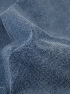 Losvallende jeans met rij knopen
