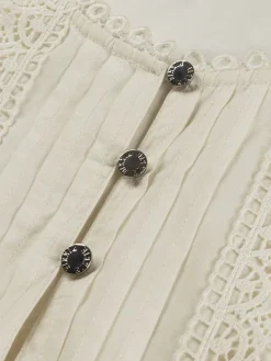 Mouwloze top met volants en broderie