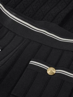 Opengebreide broek met witte biezen