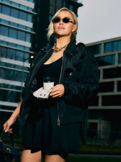 Oversized bomber jack met pailletten en geplooide mouwen