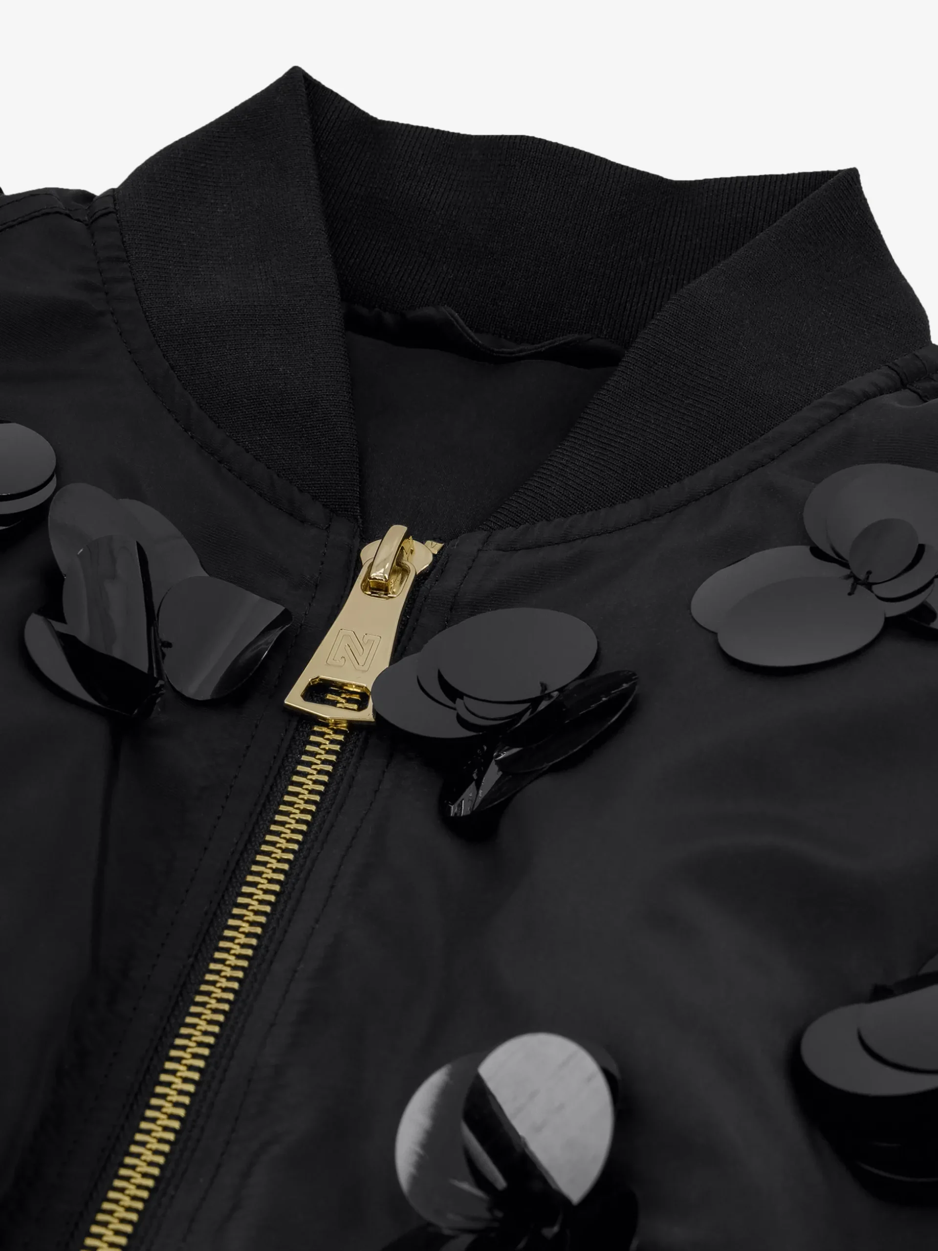 Oversized bomber jack met pailletten en geplooide mouwen