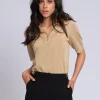 Polo top met glitters en N-knopen