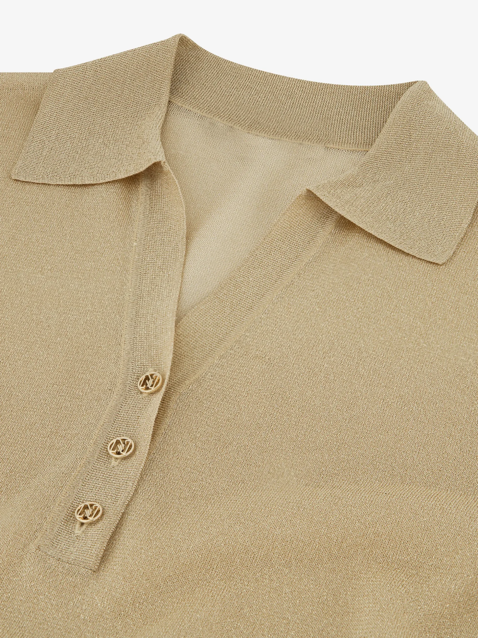 Polo top met glitters en N-knopen