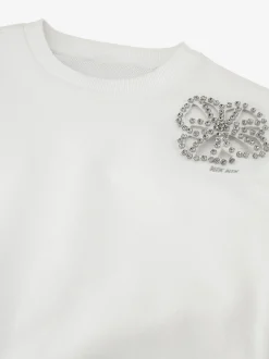 Sweater met bloemvormige uitsnede en strass-details