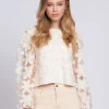 Top with embroidered flowers and mesh balloon sleeves